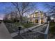 Beautiful modern farmhouse with white siding, black accents, and a charming fenced front yard at 2948 S Clarkson St, Englewood, CO 80113