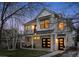Charming two-story home with a modern design, brick accents, and a welcoming front porch and balcony at 2948 S Clarkson St, Englewood, CO 80113