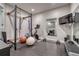 Home gym with exercise equipment, mirrors, and rubber flooring at 2948 S Clarkson St, Englewood, CO 80113