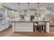Modern kitchen with white cabinets, a large island, and stainless steel appliances at 2948 S Clarkson St, Englewood, CO 80113