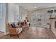 Bright living area with hardwood floors, comfortable seating, and a decorative fireplace at 2948 S Clarkson St, Englewood, CO 80113