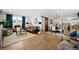 Spacious open-concept living area with a dining area and a sliding barn door feature at 2948 S Clarkson St, Englewood, CO 80113