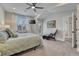 Bright primary bedroom with high ceilings, a ceiling fan, and large windows at 2948 S Clarkson St, Englewood, CO 80113