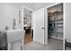 Bright mudroom includes utility sink, storage closet, and tiled flooring at 2948 S Clarkson St, Englewood, CO 80113