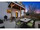 Outdoor patio with dining set, grill, and string lights at 2948 S Clarkson St, Englewood, CO 80113