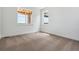 Empty bedroom has neutral walls, carpeted floors, and windows that provides natural light at 8686 Pennycress Dr, Littleton, CO 80125