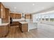 Modern kitchen features stainless steel appliances, a large island, and a view of the neighborhood at 8686 Pennycress Dr, Littleton, CO 80125