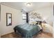 Bedroom with decorative woven baskets on wall and green patterned bedding at 8898 W Harvard Pl, Lakewood, CO 80227