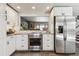 Contemporary kitchen boasts stainless steel appliances, ample counter space, and an open design perfect for entertaining at 8898 W Harvard Pl, Lakewood, CO 80227