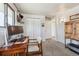 Versatile office area with a desk, storage cabinet, neutral carpet, and closet space at 8898 W Harvard Pl, Lakewood, CO 80227