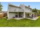 Spacious backyard featuring a well-maintained lawn, mature trees, and an inviting patio area for outdoor enjoyment at 5456 E Briarwood Pl, Centennial, CO 80122
