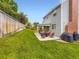 Enjoy the spacious backyard with a patio, perfect for grilling and relaxing, surrounded by a lush green lawn at 5456 E Briarwood Pl, Centennial, CO 80122