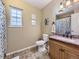 Simple bathroom with neutral walls, a single sink, and a window at 5456 E Briarwood Pl, Centennial, CO 80122