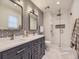 Stylish bathroom with dual vanity, modern fixtures, and glass shower at 5456 E Briarwood Pl, Centennial, CO 80122