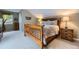 Cozy bedroom with wood furniture, comfortable bed, and soft lighting at 5456 E Briarwood Pl, Centennial, CO 80122