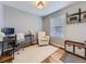 Bright office space with a large window, comfortable chair, and shelving at 5456 E Briarwood Pl, Centennial, CO 80122