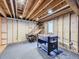 Unfinished basement provides ample potential for customization, featuring exposed beams and open layout at 5456 E Briarwood Pl, Centennial, CO 80122