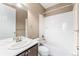 Clean bathroom with white tile, vanity, and shower-tub combination, offering a refreshing and functional space at 19722 W 59Th Ave, Golden, CO 80403