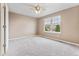 Bright bedroom features plush carpeting, neutral walls and a large window with blinds at 19722 W 59Th Ave, Golden, CO 80403