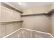 Walk-in closet with wall-mounted shelves and carpeted floor provides ample storage space at 19722 W 59Th Ave, Golden, CO 80403