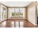 Bright dining room with hardwood floors and large windows offering serene backyard views at 19722 W 59Th Ave, Golden, CO 80403
