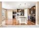 Gourmet kitchen with granite countertops, stainless steel appliances, and custom cabinetry at 19722 W 59Th Ave, Golden, CO 80403