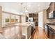 Beautiful kitchen with stainless appliances, an island with bar seating, and hardwood floors at 19722 W 59Th Ave, Golden, CO 80403