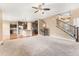 Open-concept layout with a spacious living area, hardwood floors, staircase and a modern kitchen at 19722 W 59Th Ave, Golden, CO 80403