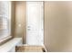 Functional mud room featuring a built-in bench, tile flooring, and convenient access to the exterior at 19722 W 59Th Ave, Golden, CO 80403