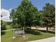 The park features a sign, walking path, trees, and playground equipment in the background at 19722 W 59Th Ave, Golden, CO 80403
