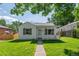 Charming front of house with well-maintained lawn at 740 Cherry St, Denver, CO 80220