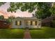 Charming single-story home with a well-manicured lawn and inviting front porch at 740 Cherry St, Denver, CO 80220