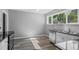 Bright kitchen featuring stainless steel appliances and dark countertops at 740 Cherry St, Denver, CO 80220