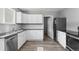 Modern kitchen with stainless steel appliances and sleek white cabinetry at 740 Cherry St, Denver, CO 80220