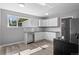 Bright kitchen featuring modern appliances, stylish flooring, and updated cabinets at 740 Cherry St, Denver, CO 80220