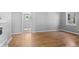 Sun-drenched living room boasts gleaming hardwood floors and neutral paint at 740 Cherry St, Denver, CO 80220