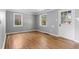 Bright living room with hardwood floors and ample natural light from two large windows at 740 Cherry St, Denver, CO 80220