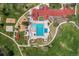 Aerial view of a community center with a large pool, playground, and sports fields at 10743 W Turtle Mtn, Littleton, CO 80127