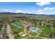 Beautiful aerial shot of community pool, clubhouse, and tennis courts set against a mountain backdrop at 10743 W Turtle Mtn, Littleton, CO 80127