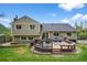 Large backyard with a spacious deck perfect for entertaining, plus a green lawn at 10743 W Turtle Mtn, Littleton, CO 80127