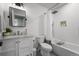 Modern bathroom with white subway tile, marble countertop vanity, and built in shower niche at 10743 W Turtle Mtn, Littleton, CO 80127