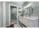 Charming bathroom with dual sinks, a modern vanity, and a stylish mirror at 10743 W Turtle Mtn, Littleton, CO 80127