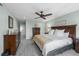 Bright primary bedroom showcases soft paint, a ceiling fan, and ample space at 10743 W Turtle Mtn, Littleton, CO 80127