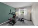 Bright exercise room featuring modern equipment, fresh paint, and natural light from the window at 10743 W Turtle Mtn, Littleton, CO 80127