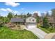 Charming two-story home with a well-manicured lawn, attached garage, and inviting curb appeal at 10743 W Turtle Mtn, Littleton, CO 80127