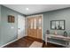 Bright and welcoming foyer with hardwood floors, decorative glass door, and stylish console table at 10743 W Turtle Mtn, Littleton, CO 80127