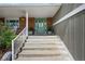 Welcoming front porch with a decorative glass door, charming plants, and well-maintained landscaping at 10743 W Turtle Mtn, Littleton, CO 80127