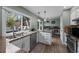 Bright kitchen boasts stainless steel appliances, granite counters, and a view of a backyard dining space at 10743 W Turtle Mtn, Littleton, CO 80127