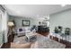 Cozy living room with hardwood floors, stylish furnishings, and a seamless transition to the dining area at 10743 W Turtle Mtn, Littleton, CO 80127