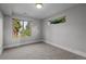 A bedroom with carpet and two windows at 2523 N Humboldt St, Denver, CO 80205